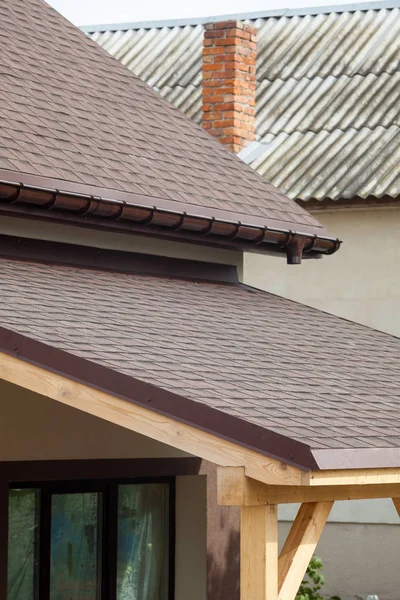 Asphalt shingles or bitumen tiles on the terrace and rooftop outdoor.