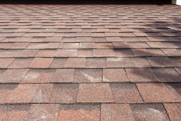 Close up of new roof with asphalt shingles