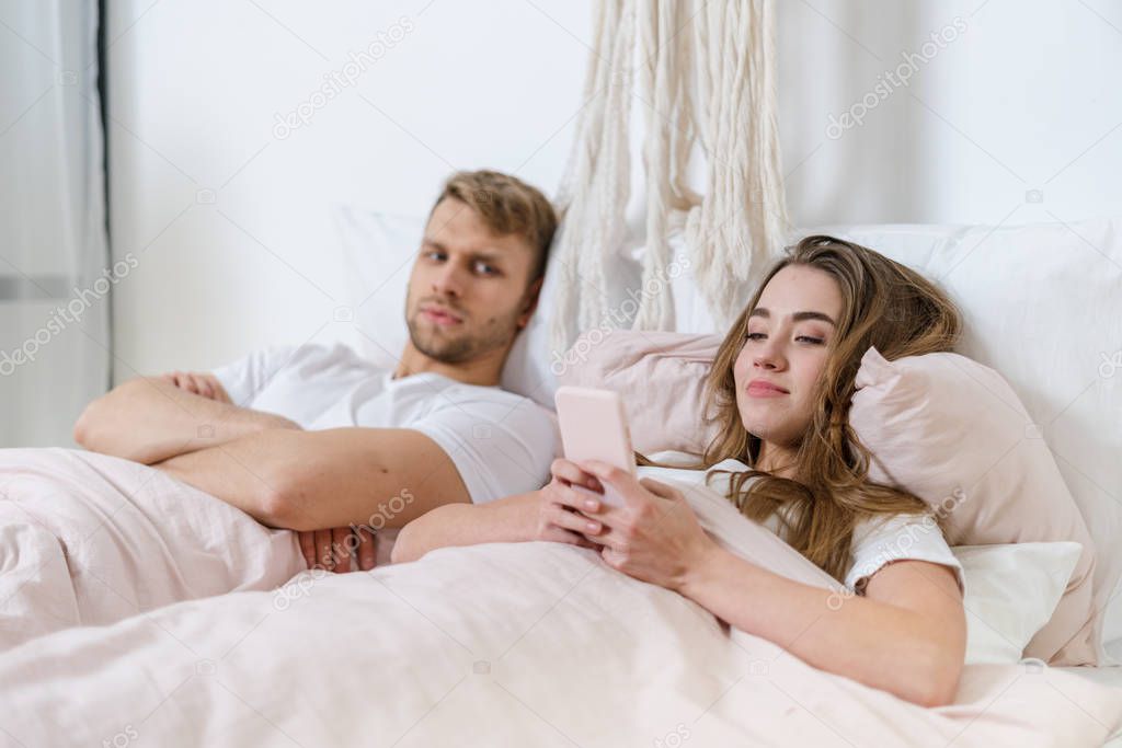 Young adult boyfriend and girlfriend spending morning at home