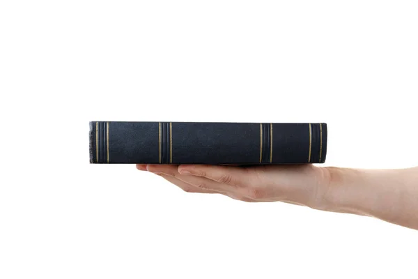Mano umana tenendo libro nero isolato su sfondo bianco — Foto Stock