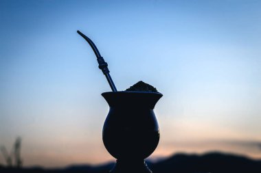 Chimarrão, or mate, is a characteristic drink of the culture of southern South America bequeathed by indigenous cultures. It consists of a gourd, a pump, ground yerba mate and warm water.