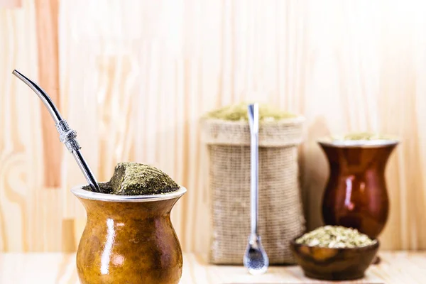 Chimarrão, or mate, is a characteristic drink of the culture of southern South America. mate bowl with mate herb, pump and accessories for preparing mate herb. Space for text. —  Fotos de Stock