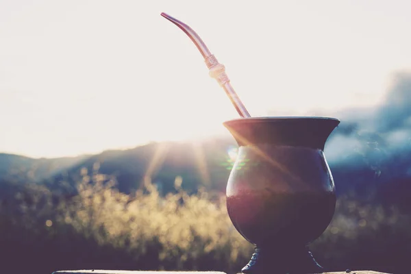 Chimarrão, or mate, is a characteristic drink of the culture of southern South America bequeathed by indigenous cultures. It consists of a gourd, a pump, ground yerba mate and warm water. — стокове фото