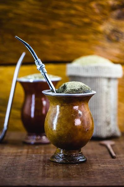 Gaucho Yerba Mate Tea The Chimarão Typical Brazilian Drink Traditionally In  A Cuiade Bombilla Stick Gourd Against Wooden Background Stock Photo -  Download Image Now - iStock