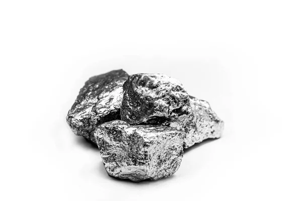 Manganese, manganese, or magnesium stone is a chemical element, it is in the manufacture of metal alloys. Silver colored ore, industrial use. Ore on black isolated background. — Stock Photo, Image