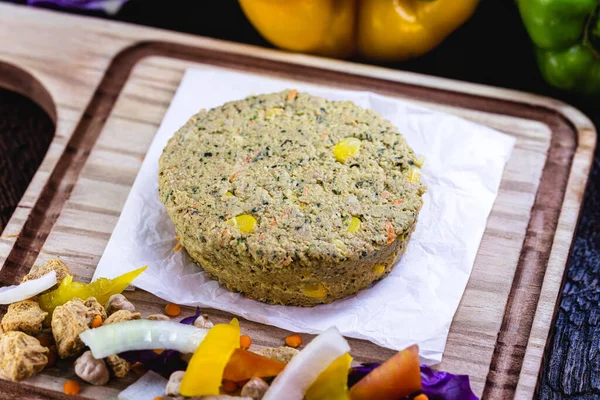 Vegan dessert or snack. Meatless hamburger based on various vegetables, seeds and protein, such as soybeans, chickpeas, tomatoes, onions, red cabbage, peppers and others. Vegan life.