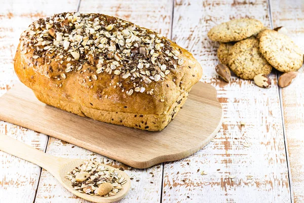 unsweetened vegan bread, covered with oats, lentils, nuts and chestnuts, chickpeas and soy. Homemade.and vegetarian bread, concept of healthy life and diet.