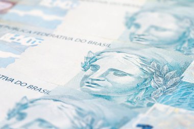 Brezilya 'dan gelen 100 reais banknotunun ayrıntıları, seçici bir odak noktası, parasal konsept için arka plan resmi. Brezilya 'daki mali kriz ya da finansal iş.