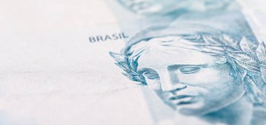 Brezilya 'dan gelen 100 reais banknotunun ayrıntıları, seçici bir odak noktası, parasal konsept için arka plan resmi. Brezilya 'daki mali kriz ya da finansal iş.