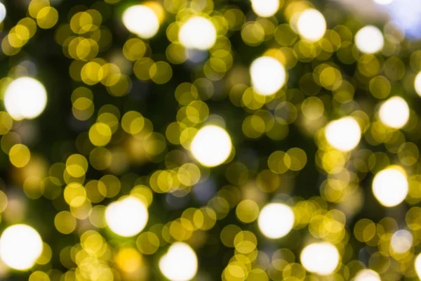 Bokeh verde e amarelo luz de fundo para Xmas — Fotografia de Stock