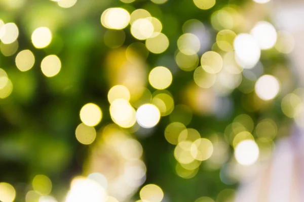 Bokeh verde e amarelo luz de fundo para Xmas — Fotografia de Stock