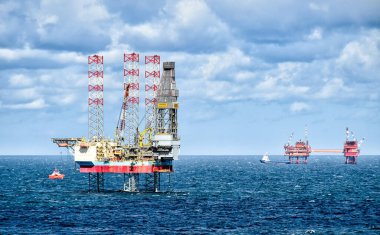 North Sea  August 10, 2018: Dilling rig MAERSK RESOLUTE and supply vessels on the North Sea near the Netherlands