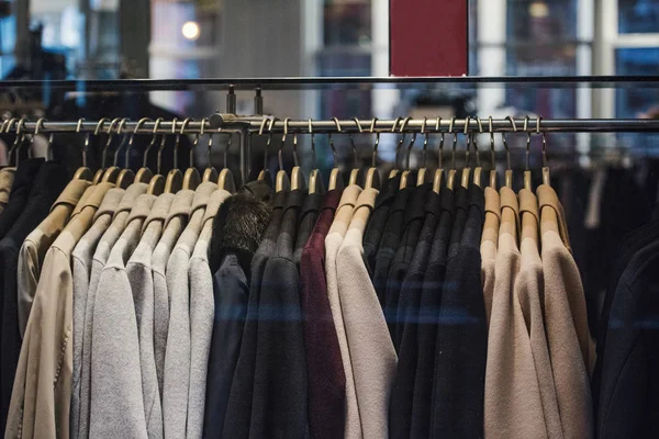 Fashion store - clothing on hangers. — Stock Photo, Image