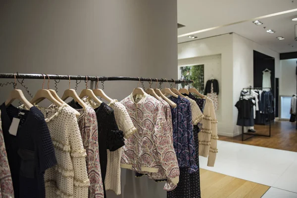 Elegant women clothes in a luxury store in Paris.