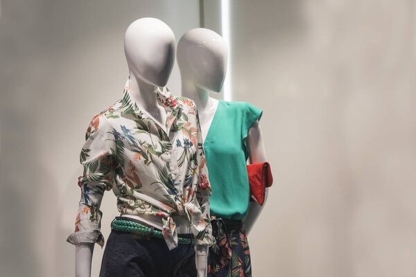 Mannequins in a showcase of a store in Paris.