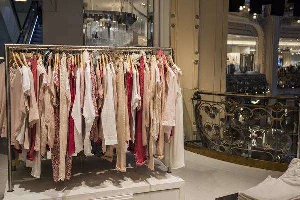 Woman clothing on racks in a store in Paris