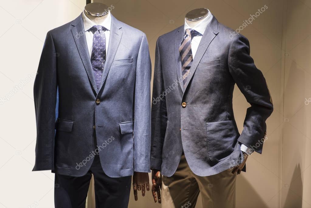 Elegant men suits in a store in Paris
