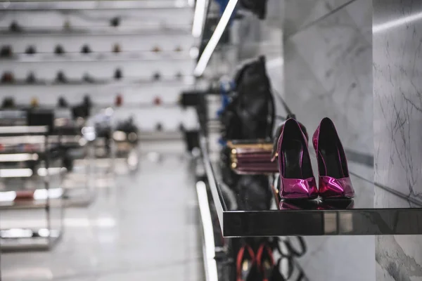 Luxury shoes and handbags in a fancy shop