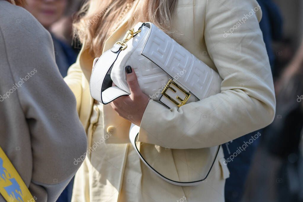 Milan, Italy - February 19, 2020: Woman holding a Fendi bagstreet style clothing and accesory detail - StreetStyleFW2020