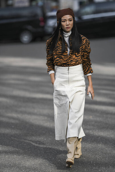 Milan, Italy - February 21, 2020: Street style appearance during Milan Fashion Week - streetstylefw20