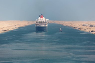 The Queen Mary 2 navigating through the Suez Canal clipart