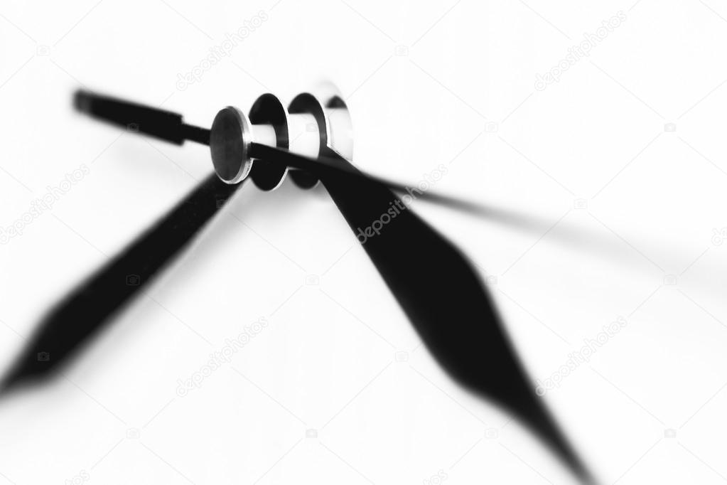 Black arrows on a white dial