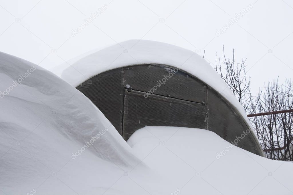 Greenhouse under the snow