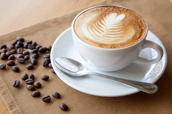 Rosetta in einer Tasse Kaffee. Stockbild