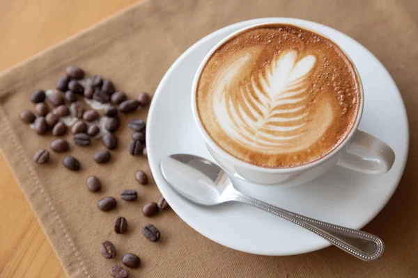 Rosetta in einer Tasse Kaffee. Stockbild