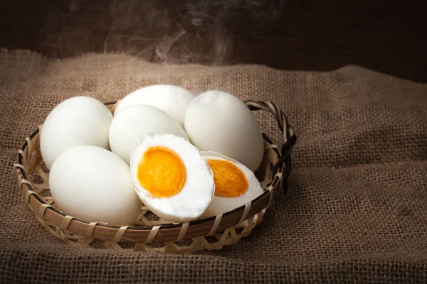 Salted eggs, boiled and ready to eat, put on basket, blurred background