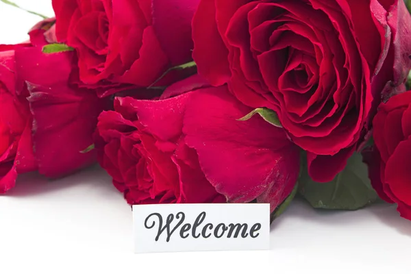 Willkommenskarte mit einem Strauß roter Rosen — Stockfoto