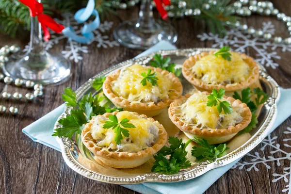 Holiday appetizer: tartlets with mushrooms and meat on a celebra — Stock Photo, Image