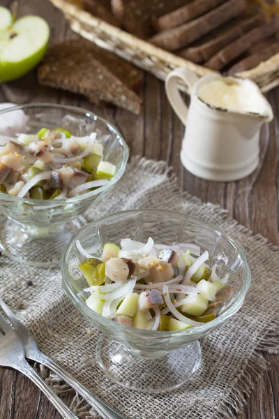 Festive salad with pickles, onions, mustard and apple. Appetizer