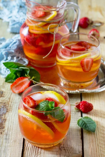 Refreshing summer drink strawberry mojito on a wooden table. The — Stock Photo, Image