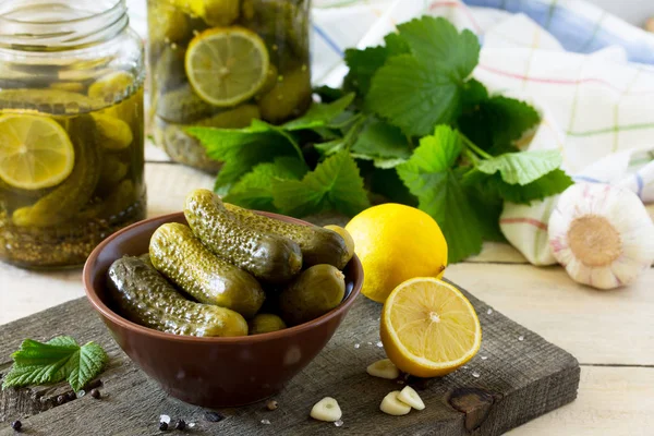 Marinated cucumbers gherkins. Pickles marinated with lemon and g