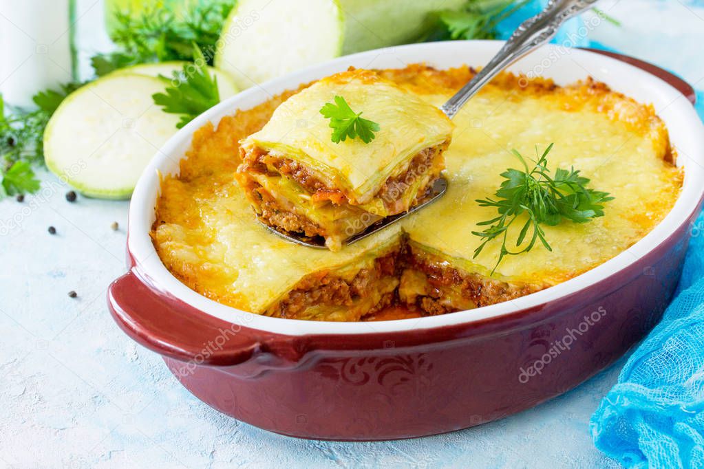 Homemade lasagna with Bolognese sauce of zucchini and minced mea