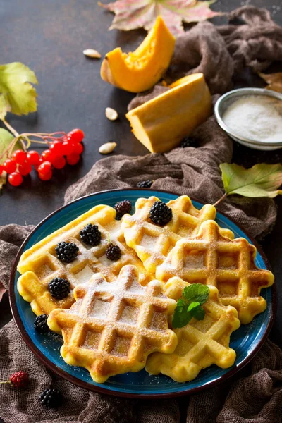 Breakfast table with pumpkin waffles and fresh blackberries on a — Stock Photo, Image