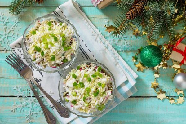 A homemade holiday snack Christmas table. Salad with squid, radi — Stock Photo, Image