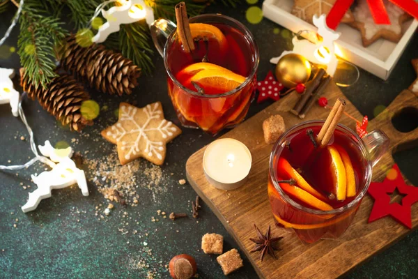 Winter Christmas mulled wine with orange and spices on the festi Stock Image