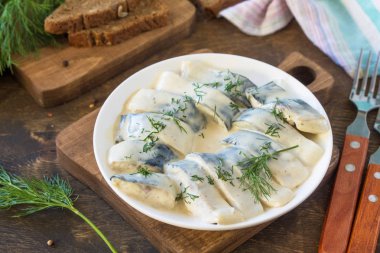 Mediterranean food. Seafood. Tasty appetizing pickled mackerel i