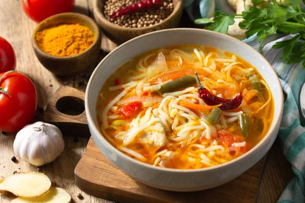 Tukpa soup of Indian cuisine. Hot noodle soup with chicken, ginger, cilantro and spices on a deyven wooden table. — Stock Image Tukpa Soup Indian Cuisine Hot Noodle Soup Chicken Ginger Cilantro Stock Picture