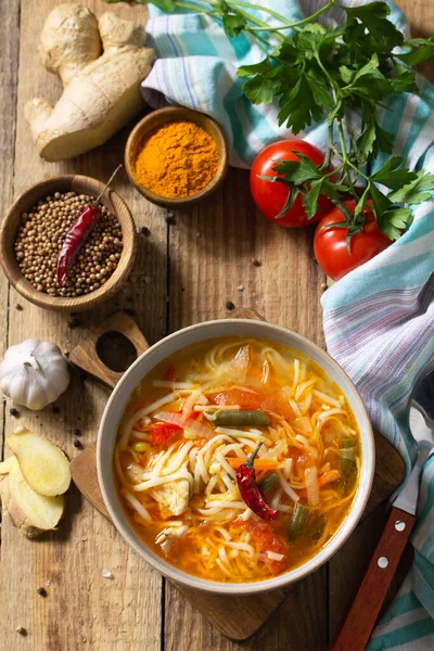 Tukpa soup of Indian cuisine. Hot noodle soup with chicken, ginger, cilantro and spices on a deyven wooden table. — Stock Image Tukpa Soup Indian Cuisine Hot Noodle Soup Chicken Ginger Cilantro Stock Photo