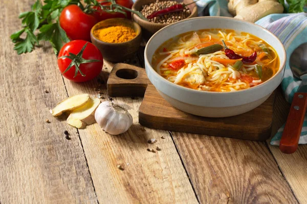 Tukpa soup of Indian cuisine. Hot noodle soup with chicken, ginger, cilantro and spices on a deyven wooden table. Copy space — Stock Image Tukpa Soup Indian Cuisine Hot Noodle Soup Chicken Ginger Cilantro Stock Photo