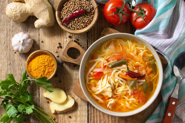 Tukpa soup of Indian cuisine. Hot noodle soup with chicken, ginger, cilantro and spices on a deyven wooden table. Top view flat lay background. — Stock Image Tukpa Soup Indian Cuisine Hot Noodle Soup Chicken Ginger Cilantro Stock Image