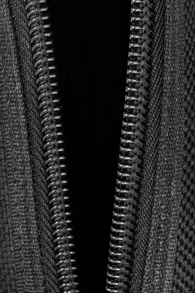 closeup open zipper and canvas texture in dark tone