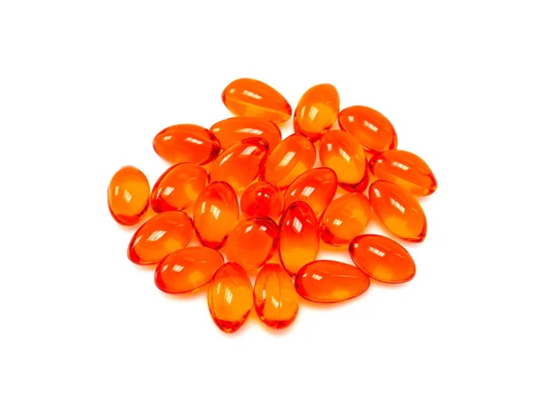 Capsules de supplément rouge isolées sur fond blanc — Photo