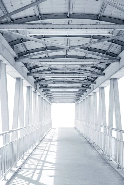 Light from the way out of modern metal structure bridge — Stock Photo, Image