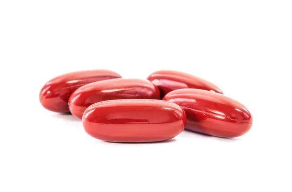 Rode aanvulling capsules geïsoleerd op witte achtergrond Rechtenvrije Stockfoto's