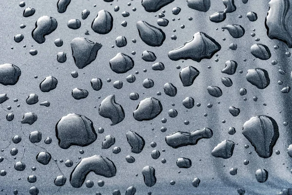 Tekstura krople deszczu na powierzchnię samochodu po deszczu — Zdjęcie stockowe