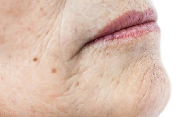 Ráncos öreg ázsiai nő bőr textúra — Stock Fotó